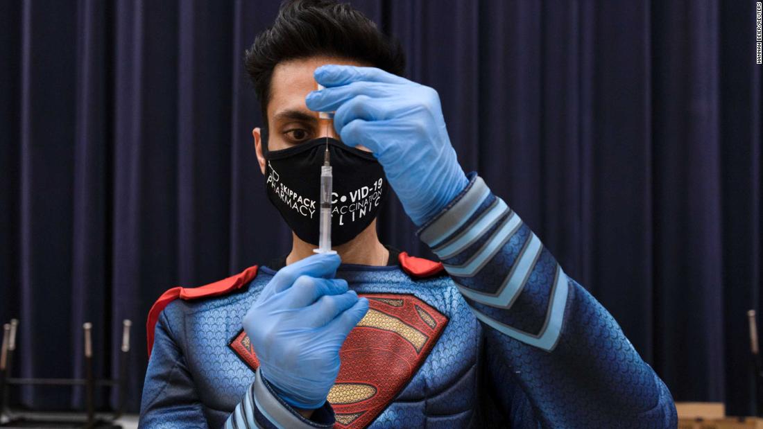 Dr. Mayank Amin, dressed as Superman, prepares a Covid-19 vaccine at a clinic in Collegeville, Pennsylvania, on March 7. &lt;a href=&quot;https://www.reuters.com/article/us-health-coronavirus-usa-pharmacy/how-one-small-pennsylvania-pharmacy-is-vaccinating-thousands-idUSKBN2B21CS&quot; target=&quot;_blank&quot;&gt;Amin has been on a mission&lt;/a&gt; to vaccinate thousands of people in his rural community.