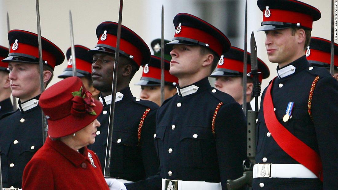 Queen Elizabeth II glances up at William, right, as she inspects the parade at the Royal Military Academy in 2006. William graduated as an Army officer and later went on to receive his Royal Air Force pilot&#39;s wings.