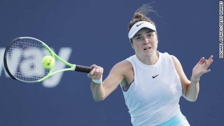 Elina Svitolina of Ukraine returns a shot to Ashleigh Barty of Australia in their semifinal match during the Miami Open at Hard Rock Stadium on April 01, 2021 in Miami Gardens, Florida.