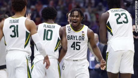 Davion Mitchell #45 of the Baylor Bears reacts with teammates in the first half against the Houston Cougars during the 2021 NCAA Final Four semifinal at Lucas Oil Stadium on April 3, 2021 in Indianapolis, Indiana.