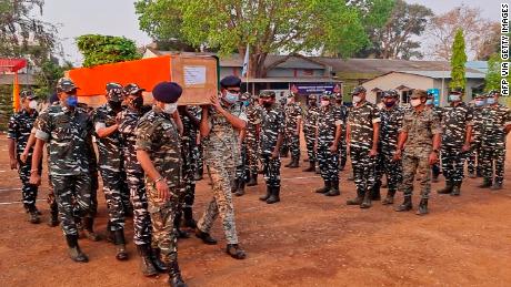 Members of Indian security forces carry the coffin of one of their colleagues, who died following a battle with Maoist rebels in India&#39;s Chhattisgarh state, on April 4.
