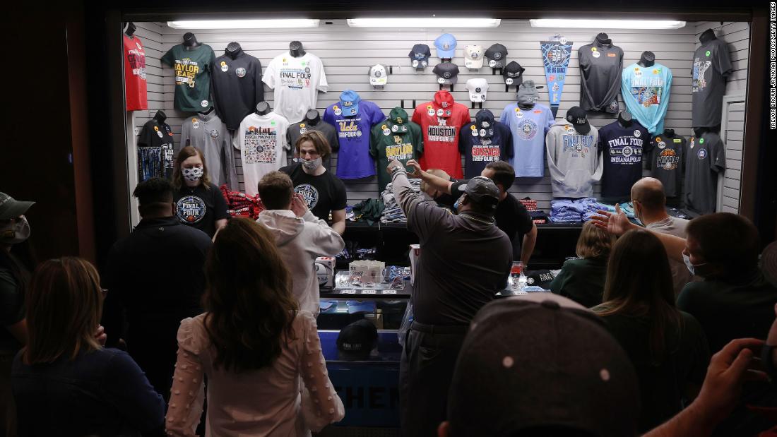 Fans purchase merchandise before the game.