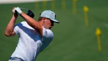 DeChambeau warms up on the range before a practice round for the Masters.