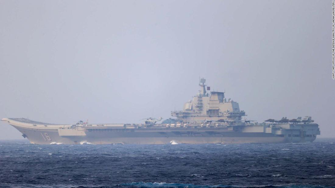 China flanks Taiwan with military exercises in air and sea