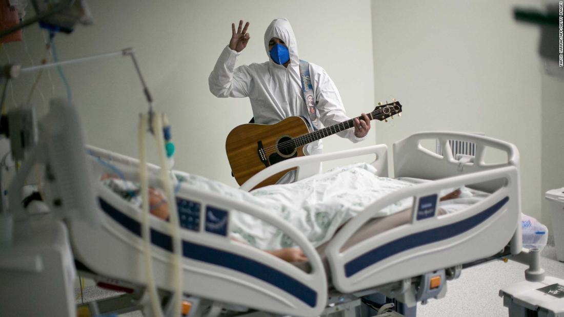 A health worker at a charity hospital in Belém, Brazil, sings and prays for a Covid-19 patient as part of Easter celebrations on April 4.