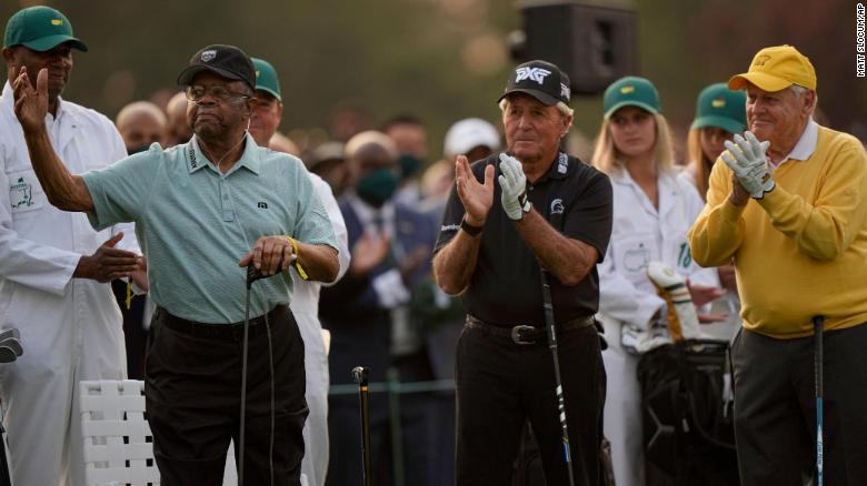 Lee Elder acknowledges applause as he joins Gary Player and Jack Nicklaus as honorary starters on Thursday, April 8. In 1975, Elder became the first African American to ever play in the Masters.