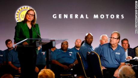 General Motors Chairman and CEO Mary Barra speaks while and United Auto Workers President Gary Jones (right) listens before they opened the 2019 GM-UAW contract talks with the traditional ceremonial handshake on July 16, 2019 in Detroit.