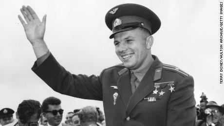 Gagarin waves to crowds who have come to see him at the Soviet exhibition at London&#39;s Earls Court, July 11, 1961.