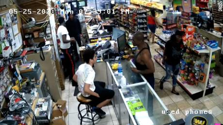George Floyd is seen at the counter in a black tank top in this surveillance video from Cup Foods before the police were called.