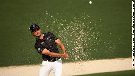 Abraham Ancer plays a shot from a bunker on the 2nd hole during the first round of the Masters.