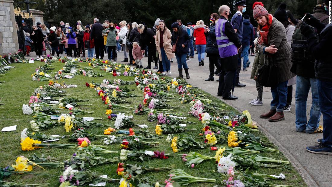 Flowers are left at Windsor Castle&#39;s Cambridge Gate on Saturday, April 10.