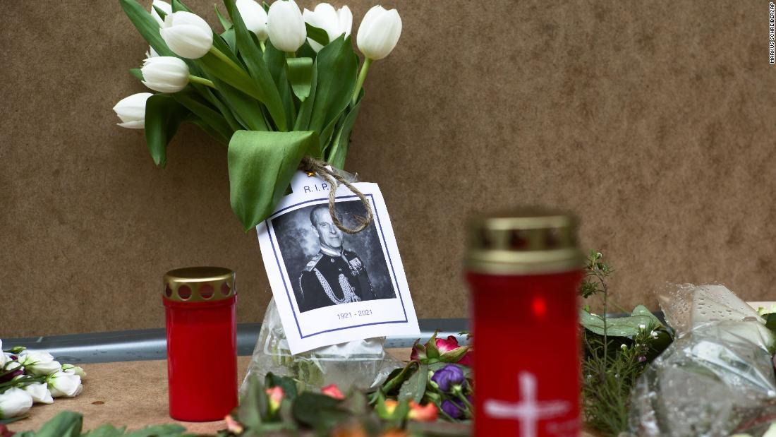 A portrait of Prince Philip is placed with flowers and candles in front of the British Embassy in Berlin.