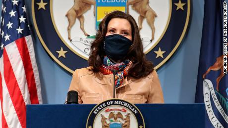 In this photo provided by the Michigan Office of the Governor, Gov. Gretchen Whitmer addresses the state during a speech in Lansing, Mich. Friday, April 9, 2021. Faced with the country&#39;s highest rate of new coronavirus infections, Whitmer on Friday urged a two-week suspension of in-person high school classes, all youth sports and indoor restaurant dining. (Michigan Office of the Governor via AP)