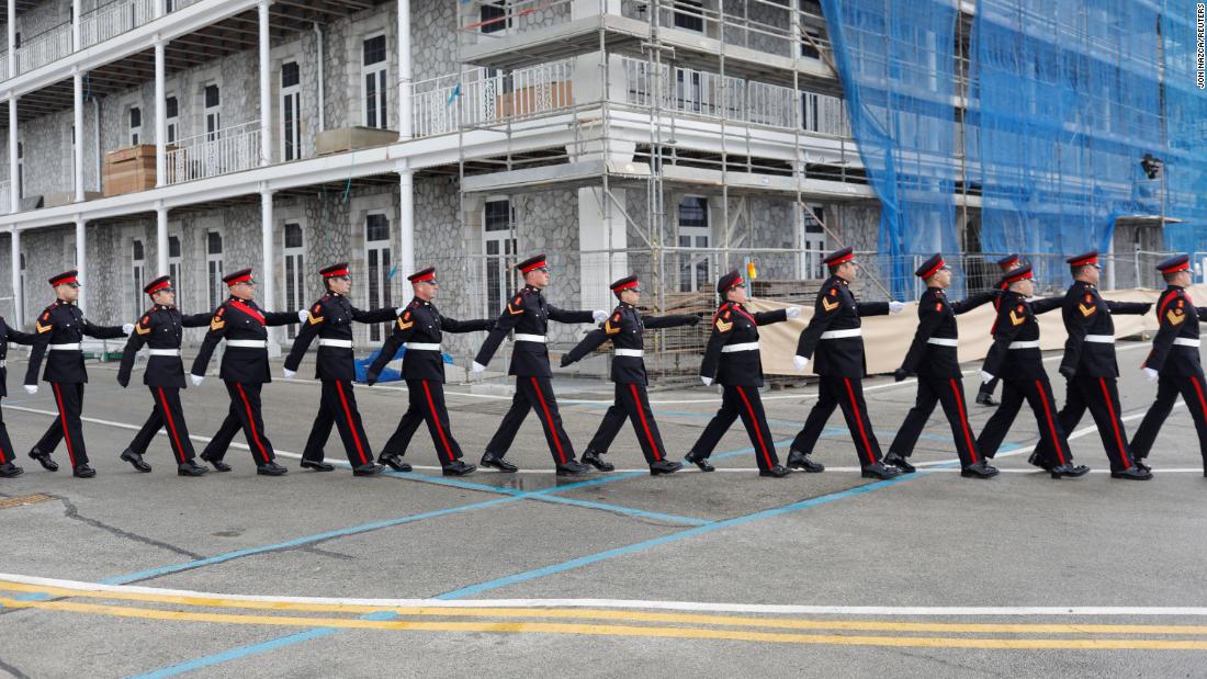 Members of the Royal Gibraltar Regiment march before firing a 41-gun salute in Gibraltar on Saturday, April 10.