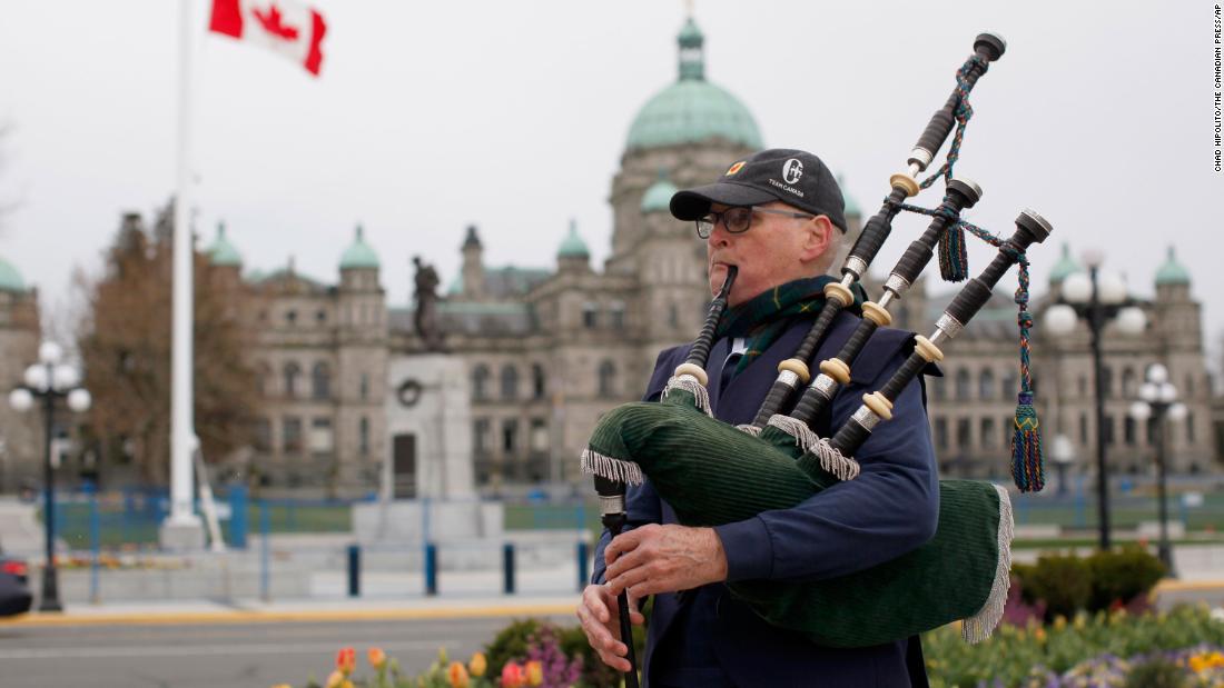 Piper Ken Wilson plays the &quot;Heights of Dargai&quot; in honor of Prince Philip while the Canadian flag flies at half-staff at the British Columbia Legislature.