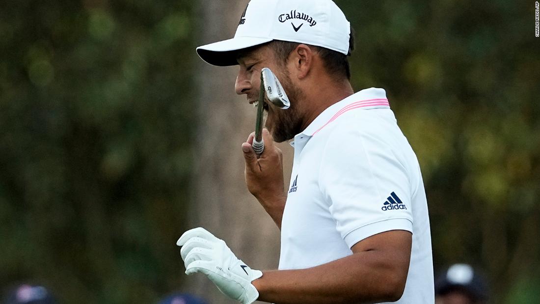 Xander Schauffele bites his club on the 16th hole Sunday. He hit the ball in the water there, effectively ending his hopes of winning the tournament.