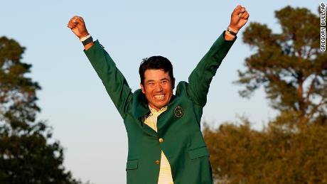 Matsuyama celebrates after putting on the champion&#39;s green jacket after winning the Masters.