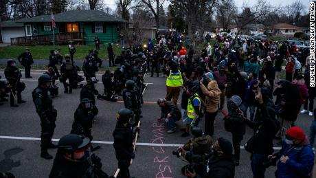 Protesters confront law enforcement on Sunday in Brooklyn Center, Minnesota.