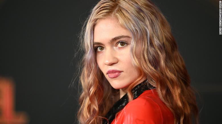 Grimes shows off the ‘beautiful alien scars’ she’s had tattooed across her back
