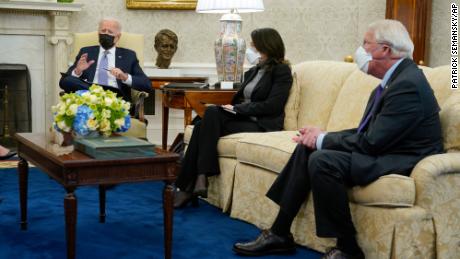 President Joe Biden speaks during a meeting with lawmakers in the Oval Office of the White House on Monday. Seated alongside Biden are Sen. Maria Cantwell, of Washington, and Sen. Roger Wicker of Mississippi. 