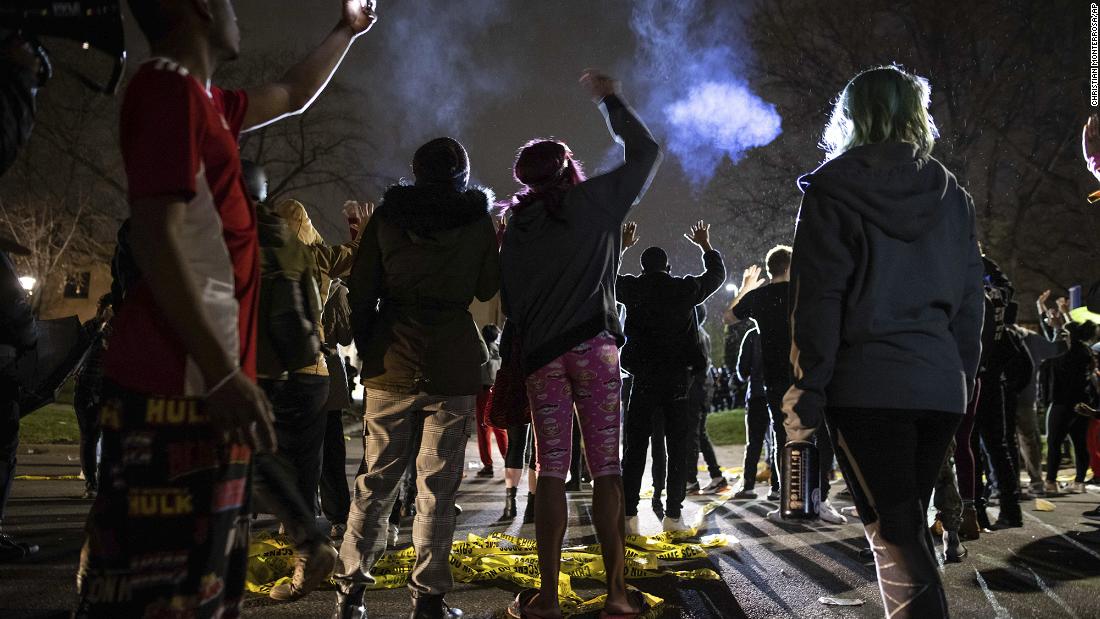 Protesters gather in front of the Brooklyn Center police station on Sunday.