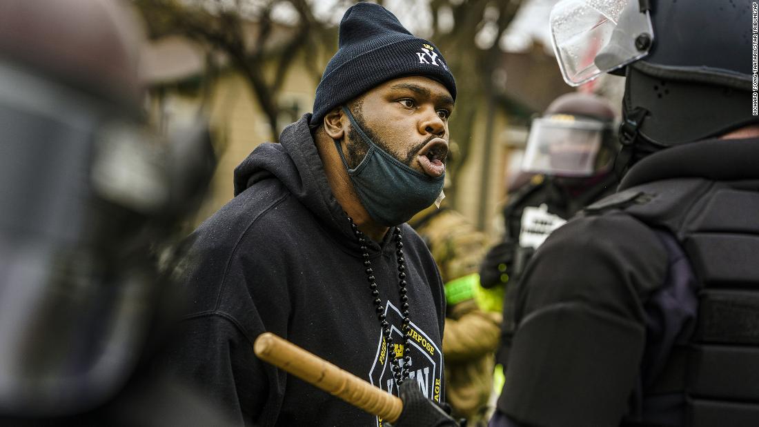 A protester confronts a police officer during a rally on Monday.