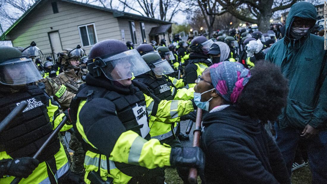 Another protester confronts police in Brooklyn Center.