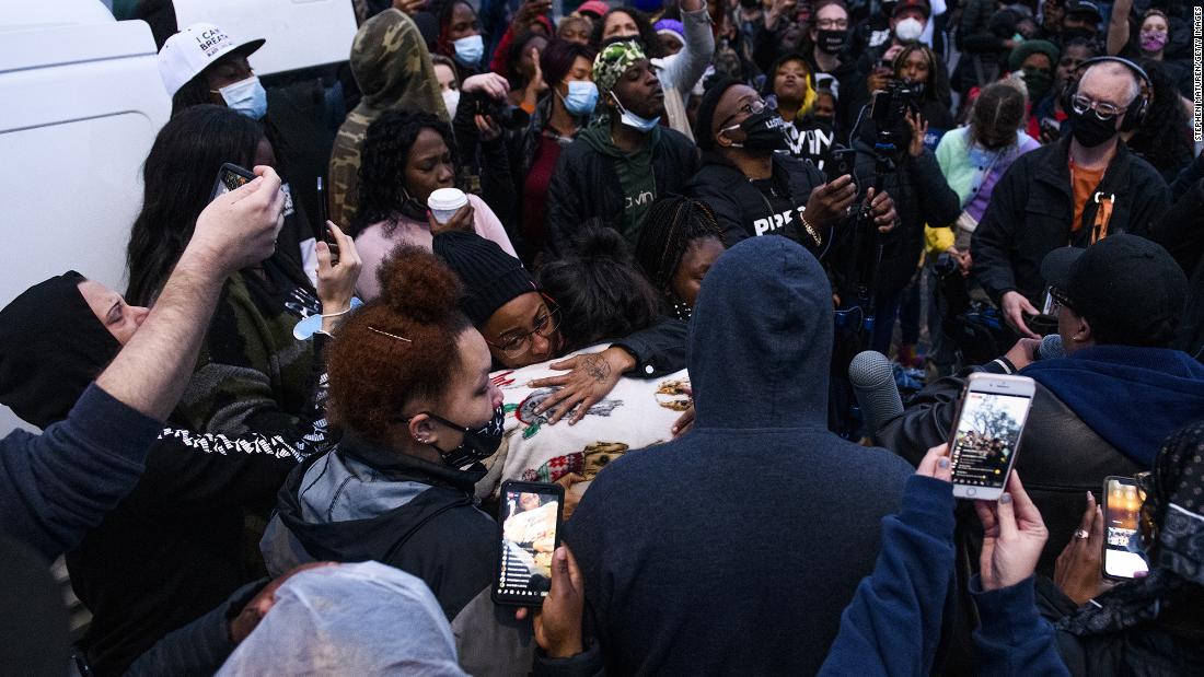 People embrace Wright&#39;s mother, Katie, as protesters gathered on Sunday.