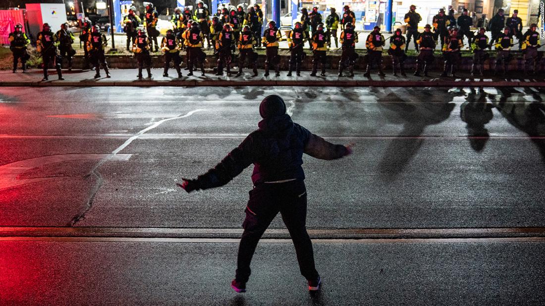 A demonstrator taunts authorities on Monday.