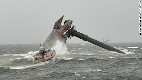 A Coast Guard crew heads toward the capsized boat off the Louisiana Coast