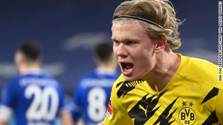 Dortmund&#39;s Norwegian forward Erling Braut Haaland celebrates scoring the 4-0 goal during the German first division Bundesliga football match FC Schalke 04 vs Borussia Dortmund in Gelsenkirchen, western Germany, on February 20, 2021. (Photo by Ina Fassbender / various sources / AFP) / RESTRICTIONS: DFL REGULATIONS PROHIBIT ANY USE OF PHOTOGRAPHS AS IMAGE SEQUENCES AND/OR QUASI-VIDEO (Photo by INA FASSBENDER/AFP via Getty Images)