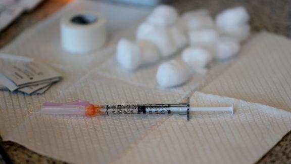 A syringe with a dose of COVID-19 vaccine sits on a table during a vaccination clinic for Special Olympics athletes, coaches and family members at Levi's Stadium on April 08, 2021 in Santa Clara, California. The San Francisco 49ers partnered with the County of Santa Clara Health System and the Santa Clara County Board of Supervisors to provide COVID-19 vaccines to Special Olympics athletes and their families. People with intellectual disabilities are 2.5 times more likely to contract COVID-19 than the general population and six times more likely to die from COVID-19 than the general population. (Photo by Justin Sullivan/Getty Images)