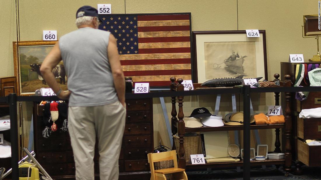 A person looks at some of the items from Madoff&#39;s estate that were auctioned off in Miami Beach, Florida, in June 2011.