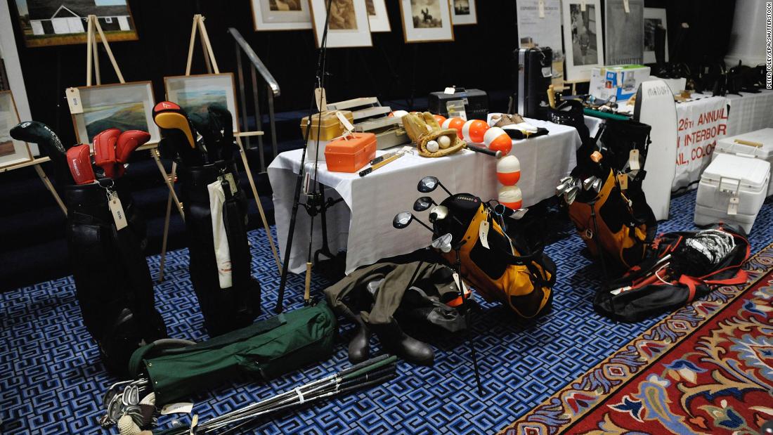 Golf clubs and fishing gear are displayed ahead of an auction of Madoff property.