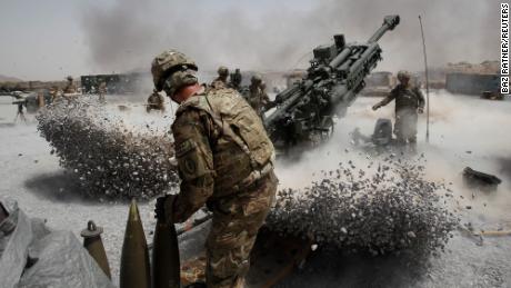 U.S. Army soldiers from the 2nd Platoon, B battery 2-8 field artillery, fire a howitzer artillery piece at Seprwan Ghar forward fire base in Panjwai district, Kandahar province southern Afghanistan, June 12, 2011. REUTERS/Baz Ratner (AFGHANISTAN - Tags: CONFLICT MILITARY IMAGES OF THE DAY POLITICS)