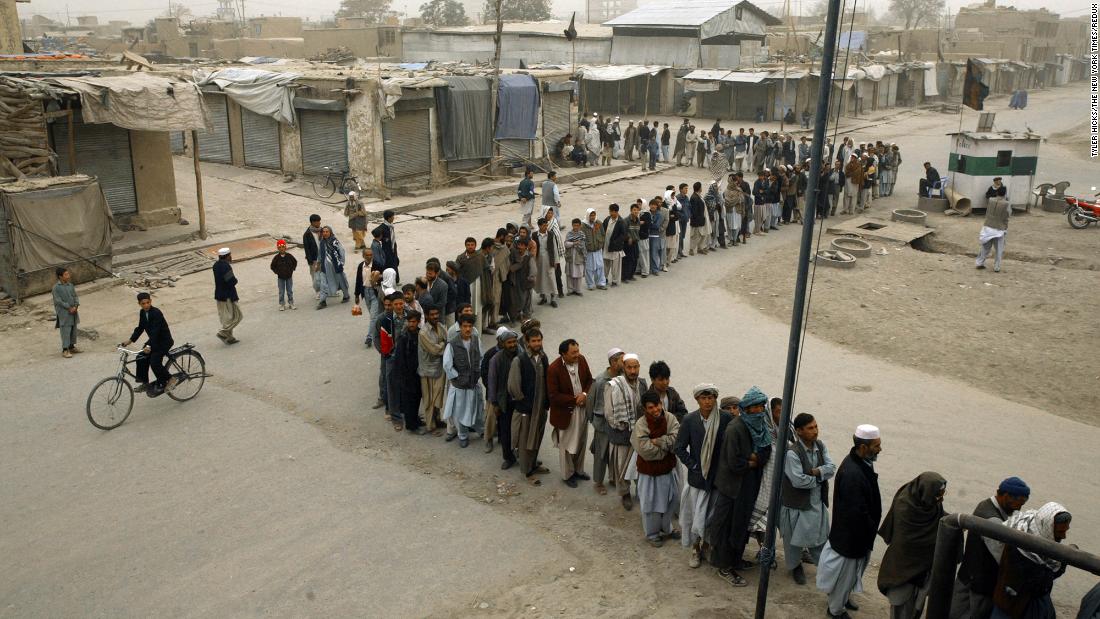 Afghans in Kabul line up to vote in the country&#39;s first democratic election in October 2004. Hamid Karzai was sworn in as President in December of that year.