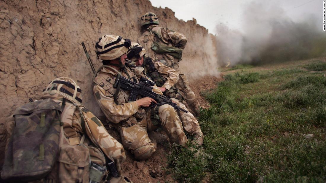 British Marines take cover during an anti-Taliban operation near Kajaki, Afghanistan, in March 2007. Many other countries also deployed troops to the country.