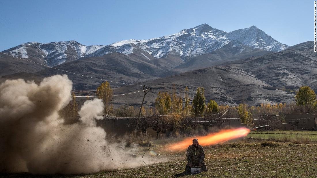 Afghan Army Sgt. Sayed Wazir screams a prayer while firing a rocket in Afghanistan&#39;s Wardak province in November 2013.