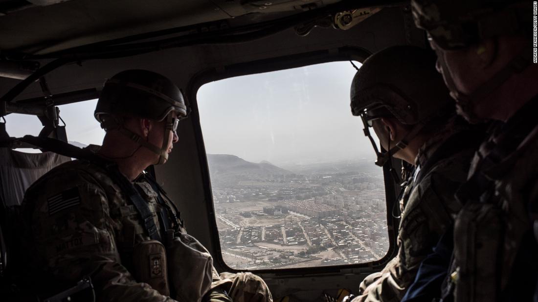 American service members ride in a helicopter on the way to the Bagram Air Base near Kabul in September 2017. President Donald Trump had recently announced a plan to increase troops in the country.