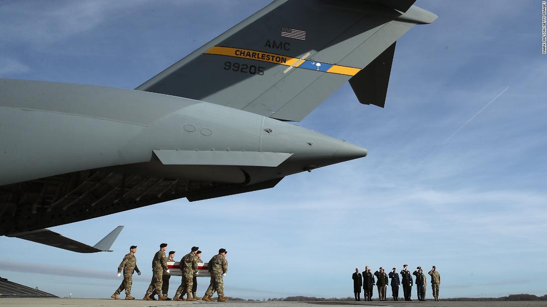 A US Army carry team moves the transfer case containing the remains of Sgt. 1st Class Michael Goble during a dignified transfer at Delaware&#39;s Dover Air Force Base in December 2019. Goble, who was from Washington Township, New Jersey, was killed during combat in Afghanistan. 