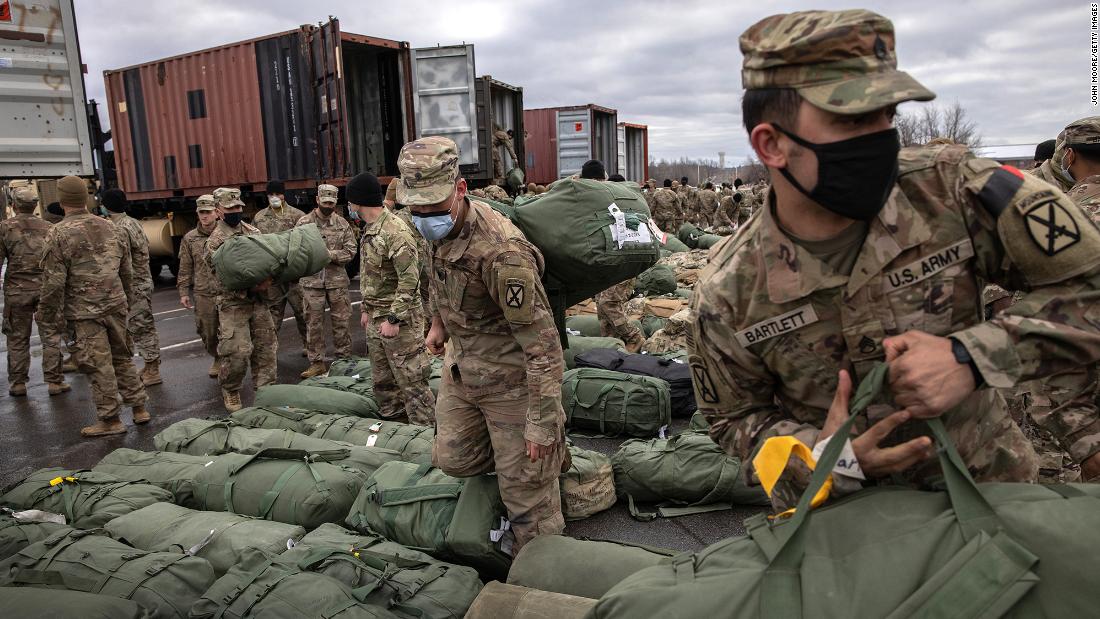 US soldiers retrieve their bags in Fort Drum, New York, in December 2020, after returning home from a nine-month deployment to Afghanistan.