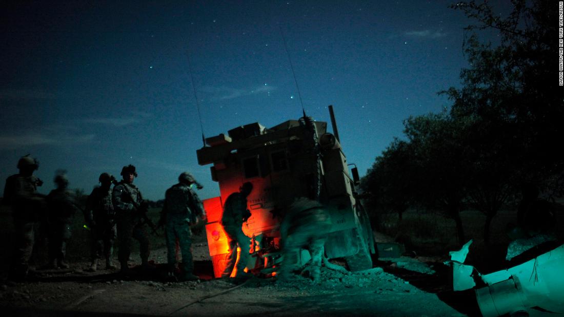 US soldiers recover an armored vehicle that was hit by an explosive device in Afghanistan&#39;s Kunduz province in April 2010.