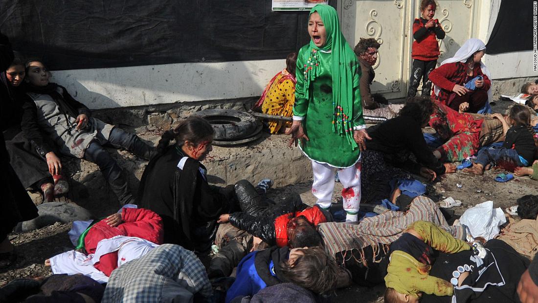 Tarana Akbari, 12, screams after a suicide bomber attacked the Abul Fazel Shrine in Kabul, Afghanistan, in December 2011. &lt;a href=&quot;https://www.cnn.com/2011/12/06/world/asia/afghanistan-violence-analysis/index.html&quot; target=&quot;_blank&quot;&gt;Twin bomb blasts&lt;/a&gt; killed dozens of Afghan people on the holy day of Ashura.