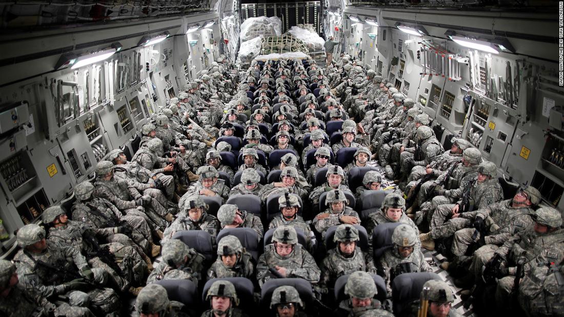 US troops, aboard a C-17 transport plane, head to Afghanistan in April 2010.