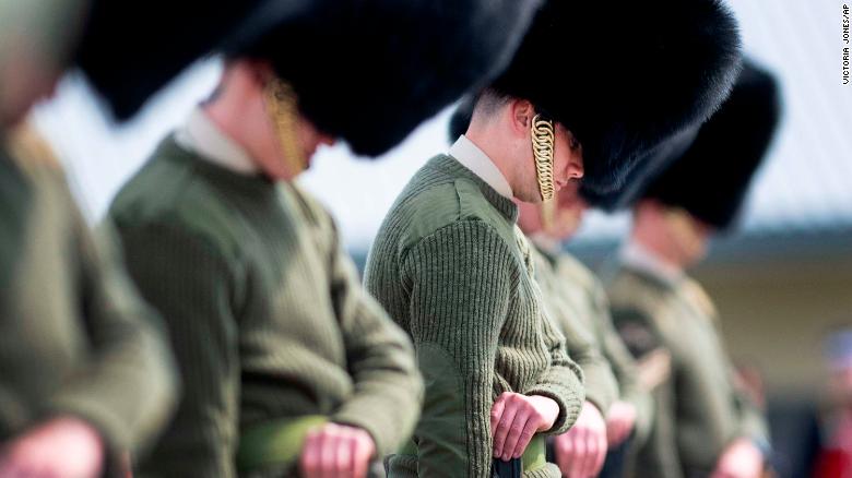 Soldiers from the Welsh Guards bow their heads as they rehearse for Prince Philip&#39;s funeral in Woking, England on Wednesday.