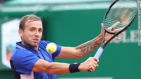 Evans in action during his quarterfinal match against Djokovic.