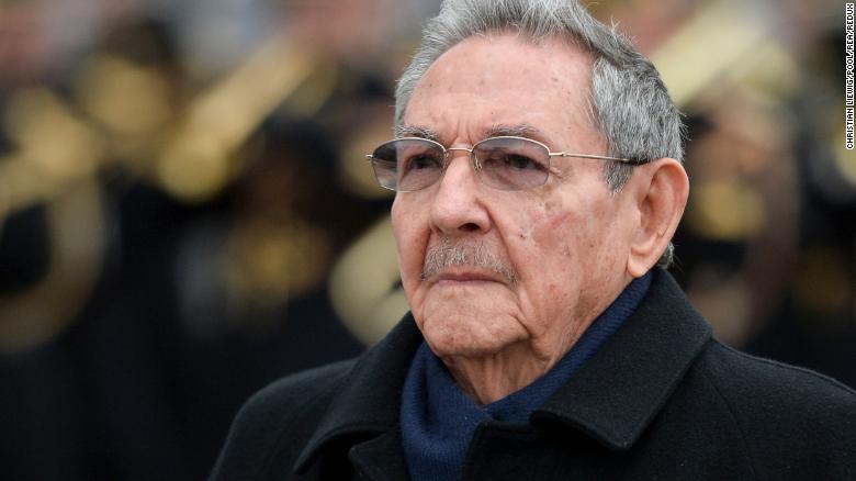 Cuba&#39;s president Raul Castro observes a welcoming ceremony at the Arc de Triomphe in Paris in 2016.
