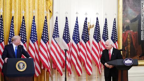 Bay of Pigs veteran Johnny Lopez de la Cruz and US President Donald Trump attend an event honoring Bay of Pigs veterans in the East Room of the White House in Washington, DC on September 23, 2020.