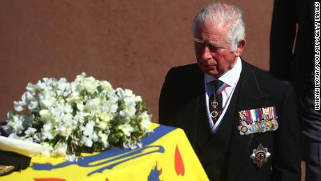 Prince Charles walks behind his father&#39;s coffin during the procession.