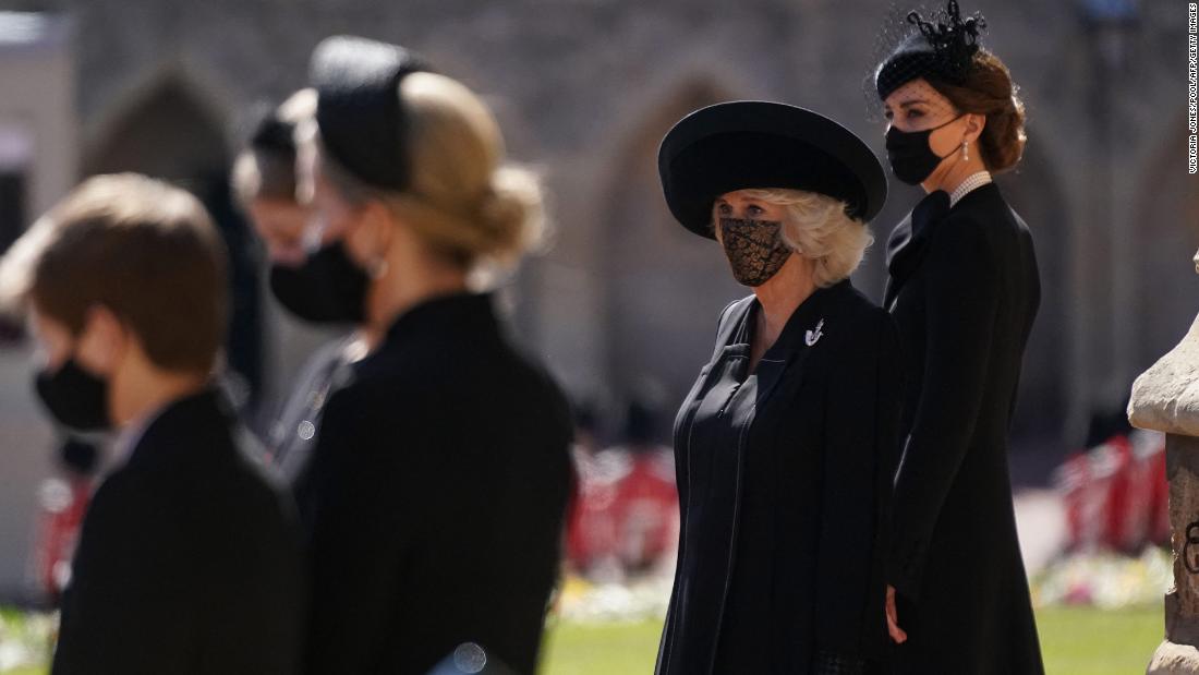 Camilla, the Duchess of Cornwall, and Catherine, the Duchess of Cambridge, stand outside St. George&#39;s Chapel before the funeral.